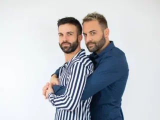 stock-photo-young-gay-couple-two-men-wearing-casual-clothes-hugging-oneself
